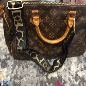 Black colored strap with gold details